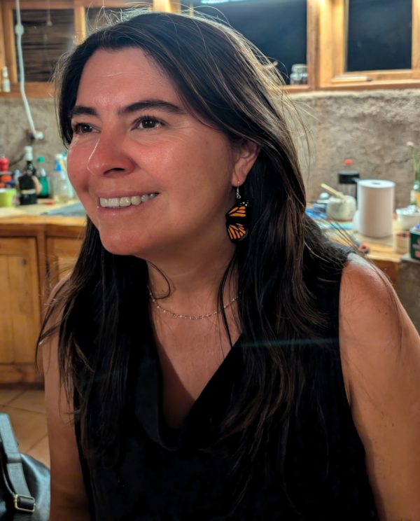 Another woman is showcasing our Monarch butterfly earrings.